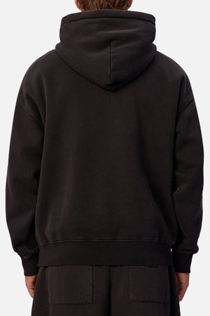 A person wearing the Industrie The New Del Sur Fleece Hoodie and matching black pants is shown from the back, hood up, with hands relaxed by their sides.