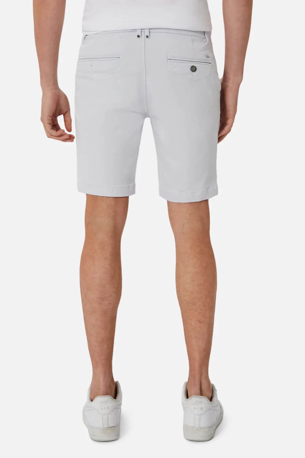 A person wearing Industrie The New Drifter Cuba Short in light gray, paired with a white shirt and white sneakers, is shown from the back, highlighting comfortable fashion against a plain white background.