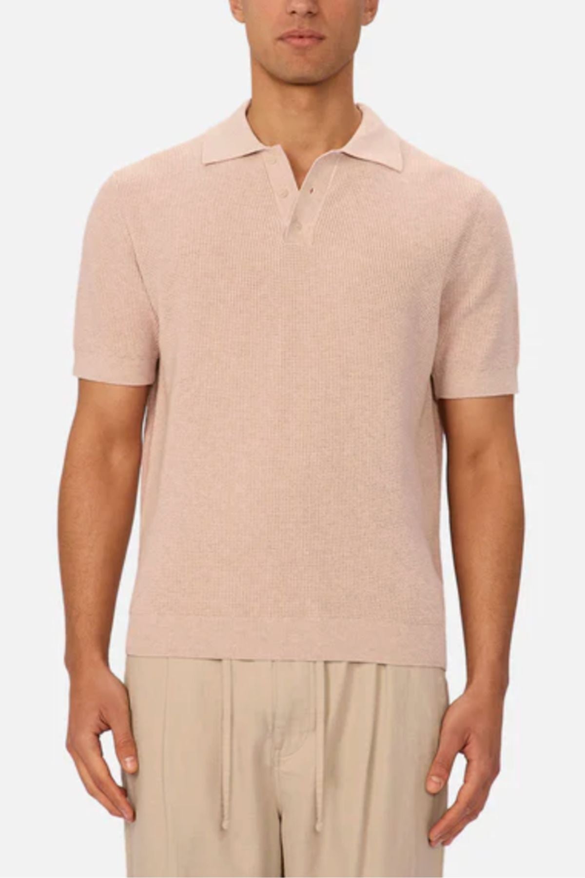 A man wearing the Industrie The Ravenna Polo in a light color.