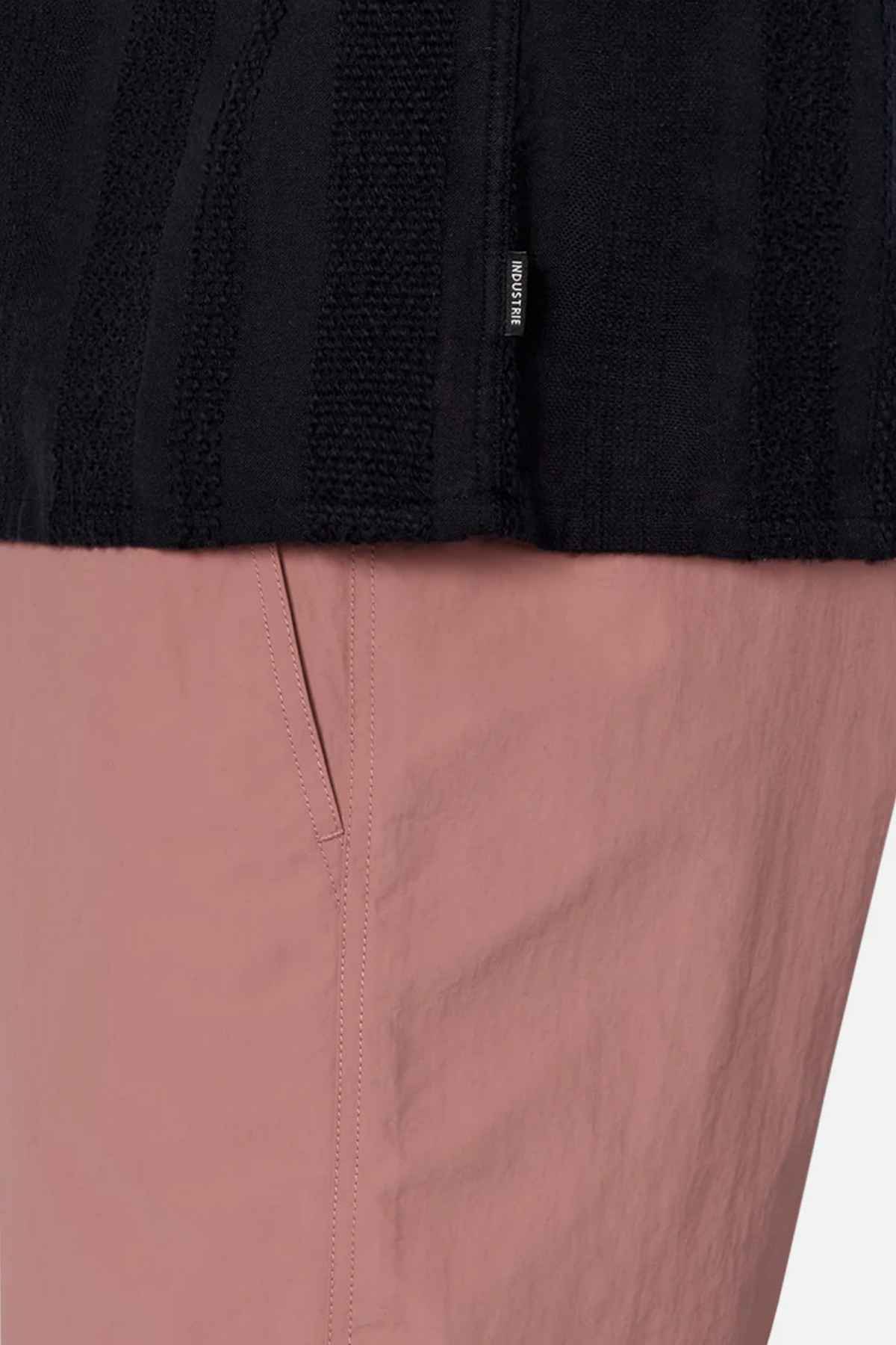 Close-up of a person wearing the Industrie The Salamanca Short Sleeve Shirt, a chic addition to any summer wardrobe. The shirt features neat details and is crafted from a cotton-linen blend that enhances the fabric's texture.