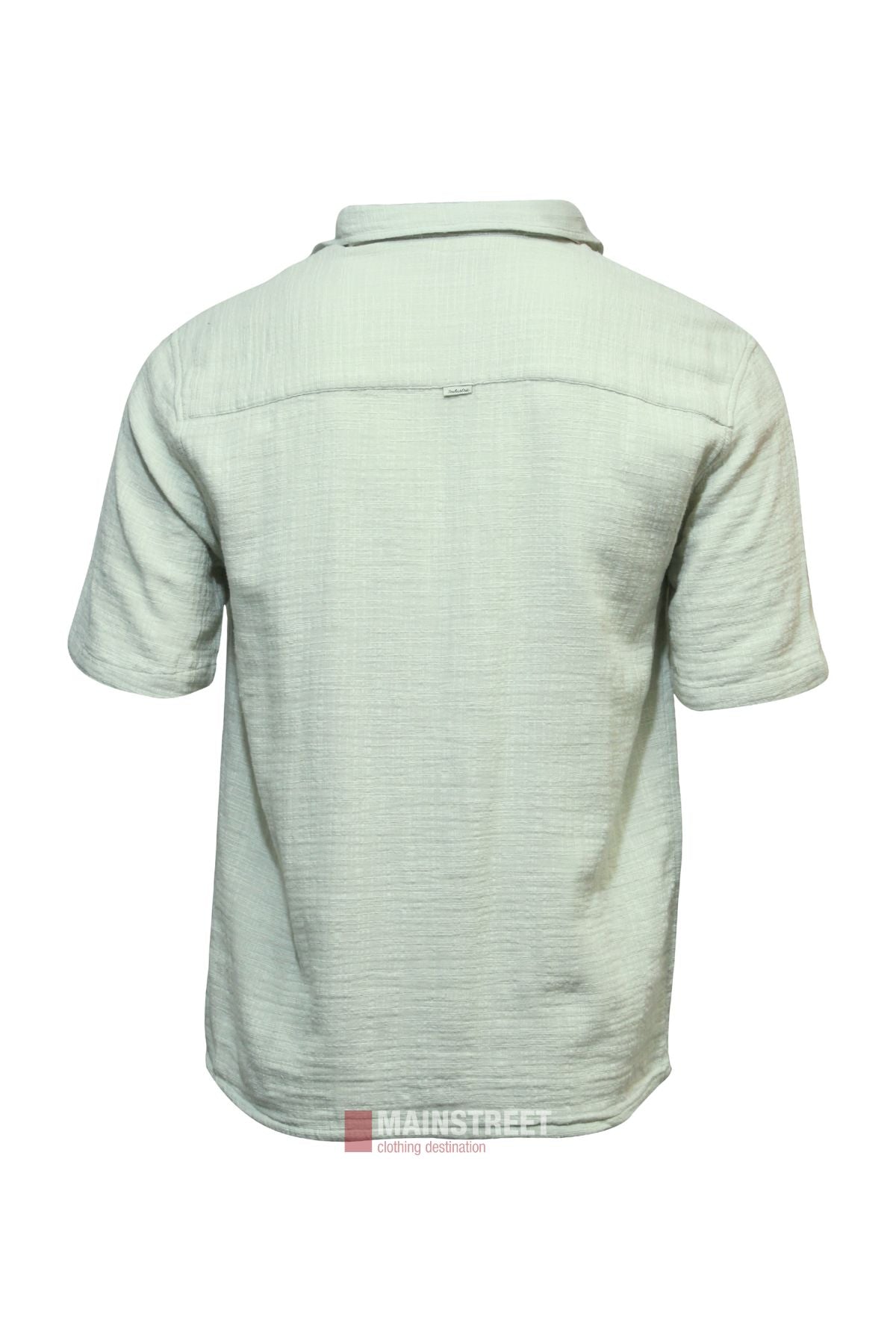 Back view of the Industrie The Seguro Short Sleeve Shirt in light green, showcasing textured fabric and a collar. This loose fit shirt has no visible patterns or logos and is set against a white background.