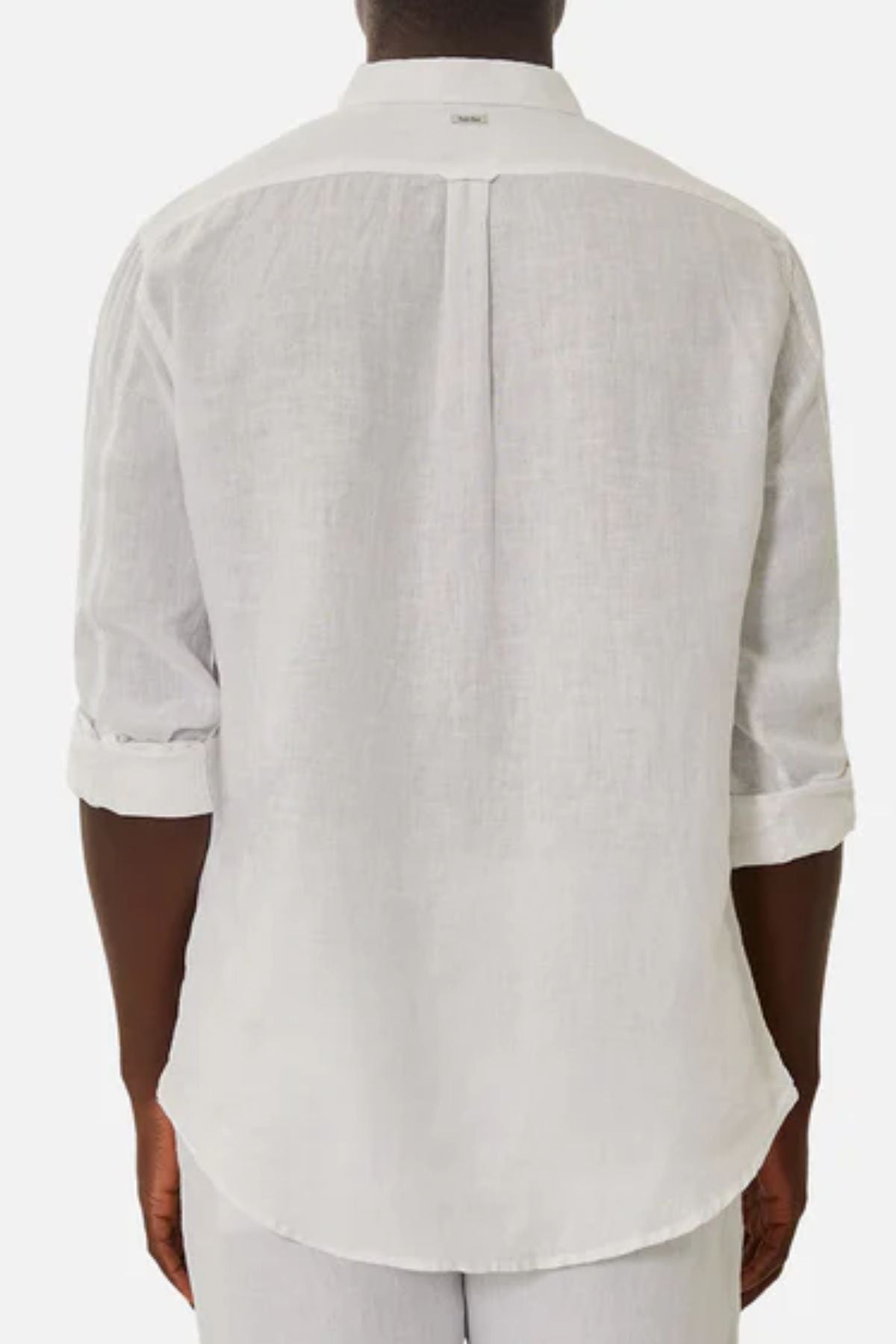 A person wears the Industrie The Tennyson Linen Blend Shirt, shown from the back. This lightweight, long-sleeve white shirt features a relaxed fit, rolled-up sleeves, and a back yoke with a central pleat.