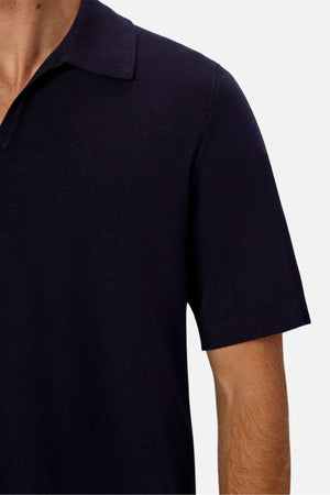 Industrie The Hampshirt Polo - Navy. Close up image of left side navy polo shirt on model