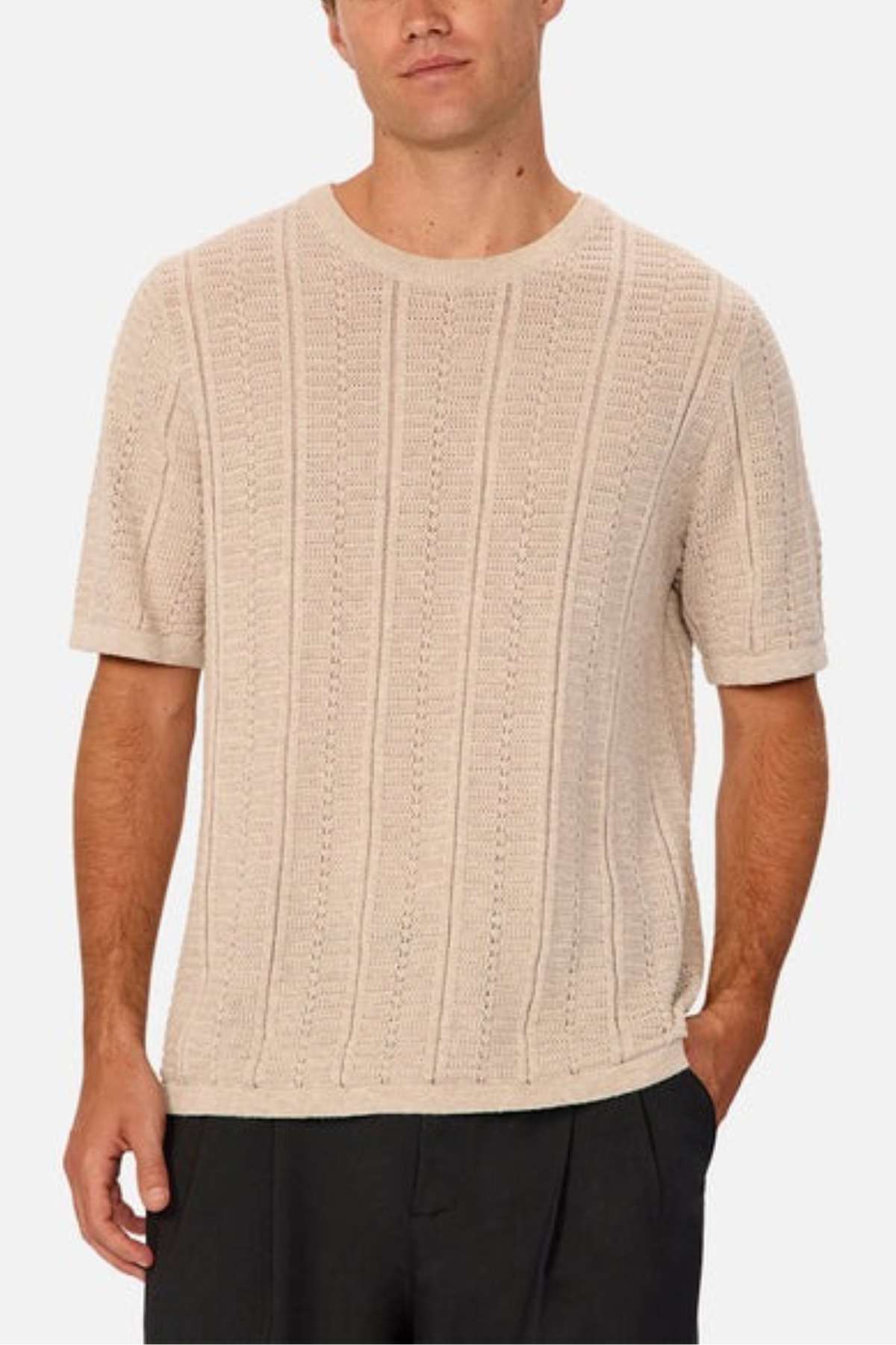 Industrie - The Nimes Tee - Chalk Marle - Front facing image Close up. Man modelling the shirt in chalk marle with black trousers.