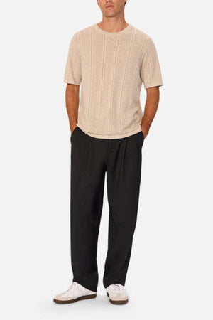 Industrie - The Nimes Tee - Chalk Marle - Front facing image - Man wearing the shirt with brown trousers