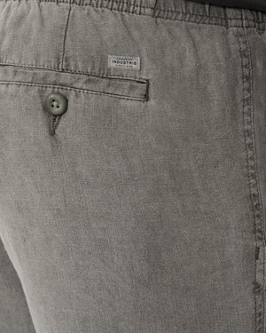 Close-up of the back pocket on Industrie The Marina Linen Short in relaxed-fit gray, featuring a button, small white "INDUSTRIE" label, visible fabric texture, stitching details, and a drawcord waist.