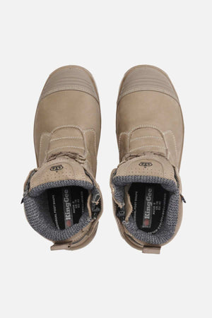 A pair of tan King Gee Bennu Pro 6 Work Boots with gray padded interiors and slip-resistant outsoles, seen from above on a white background. "KingGee" branding appears on the insoles.