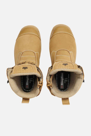 A pair of tan King Gee Bennu Pro 9 Work Boots features a soft padded collar, steel toe protection, and "KingGee" branding on the inner lining. These boots have a slip-resistant outsole and are shown from above against a white background.