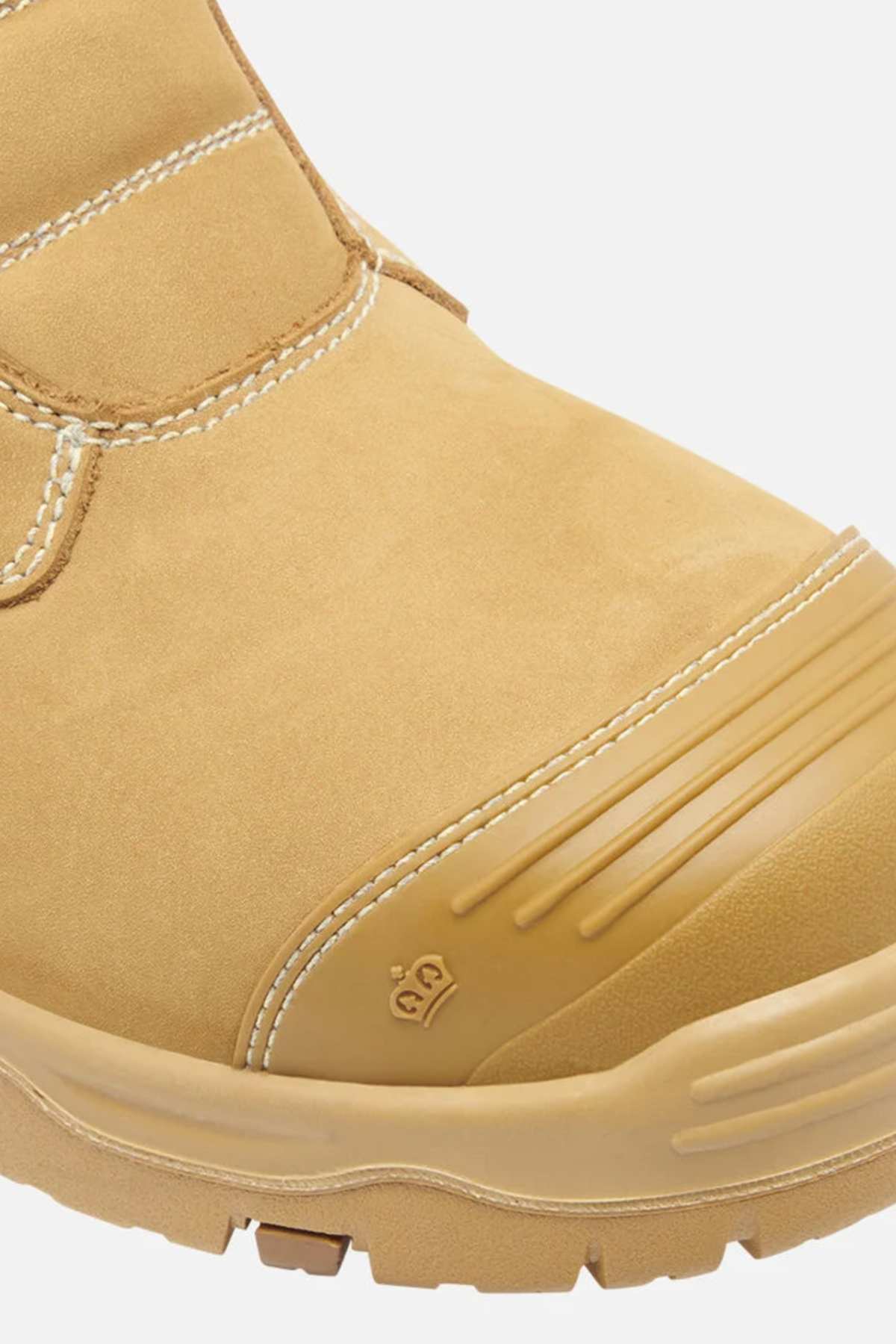 The King Gee Bennu Pro 9 Work Boot, a tan rugged design, showcases a steel toe for protection and reinforced stitching against a light gray background. It features a subtle logo on the toe cap and has a slip-resistant outsole to enhance safety.