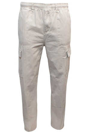 The Label One Traveller Cargo Pant in light beige features a classic fit with an elastic waist, side and thigh cargo pockets, shown against a white background.