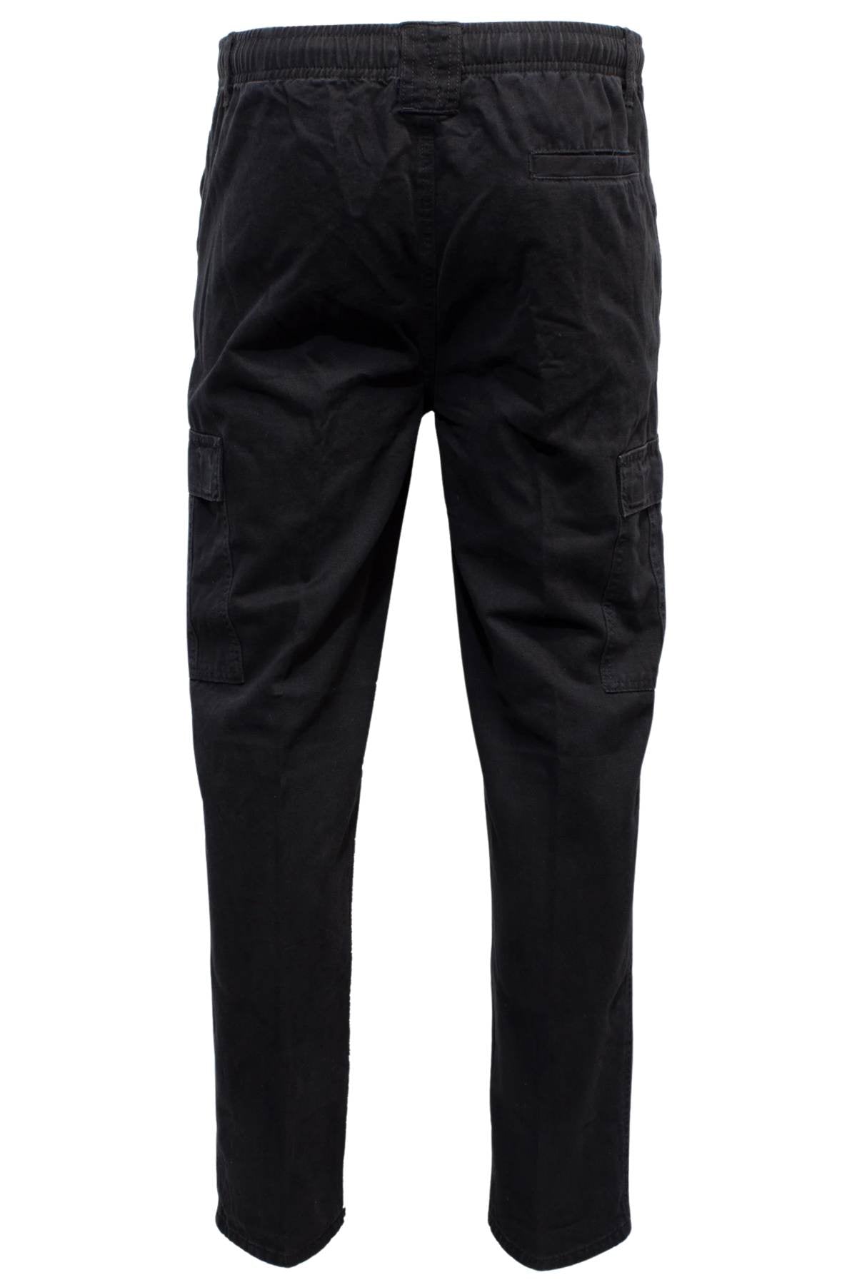 The Label One Traveller Cargo Pant in black cotton features an elastic waistband, a right back pocket, and spacious flap cargo pockets on each leg, shown from the back.