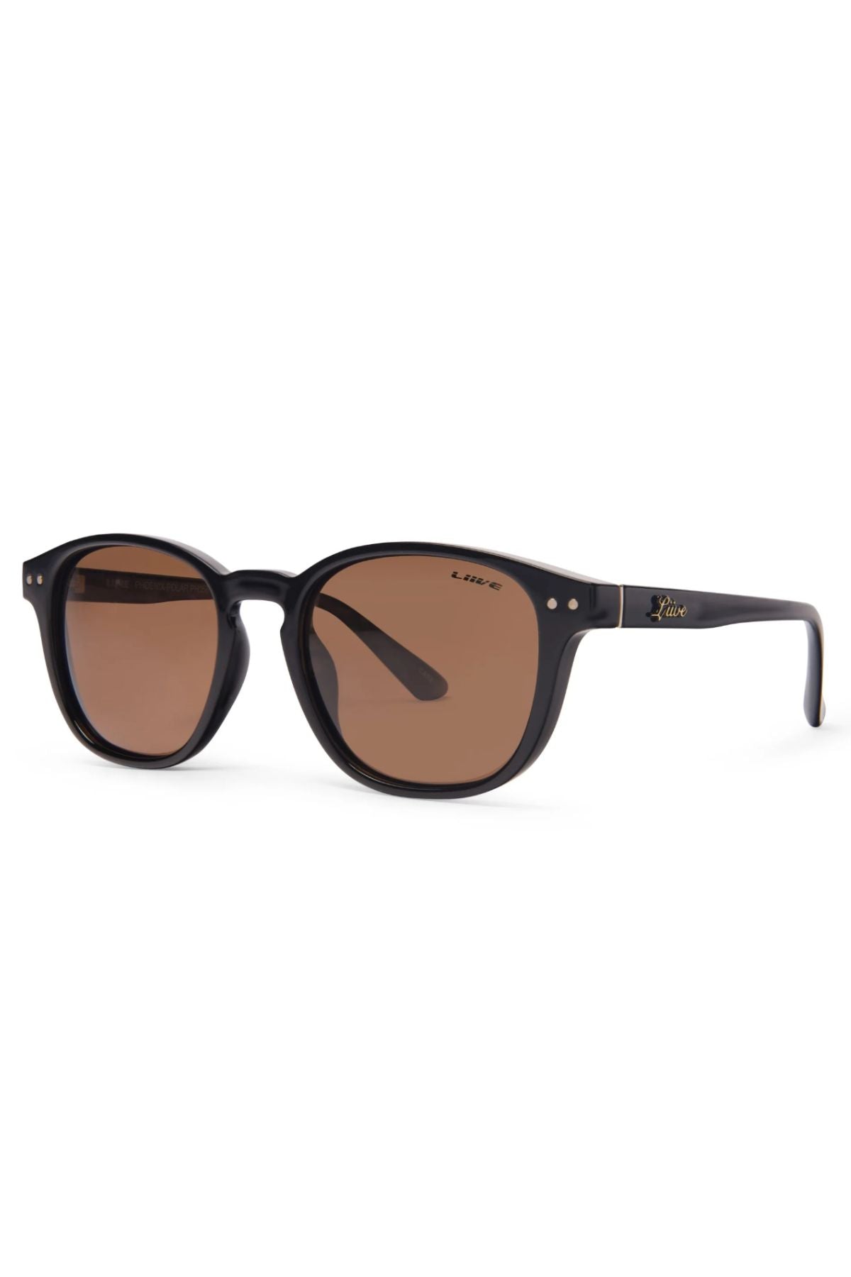 The Liive Phoenix Polarised Sunglasses feature black round frames with brown-tinted lenses, lightweight polycarbonate arms, metallic accents, and a gold logo by the hinge. Shown on a white background.