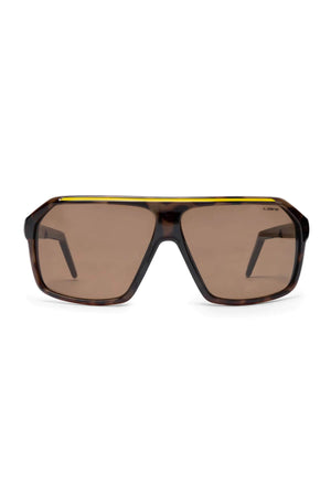 Liive Spyder Sunglasses are oversized and angular, featuring brown-tinted lenses, a dark tortoiseshell frame with a yellow top accent, and crafted from durable polycarbonate for UV protection.