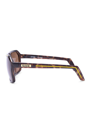 Side view of Liive Spyder Sunglasses with thick brown and yellow patterned polycarbonate arms, a small metallic "Liive" logo, and "SPYDER" printed inside the arm, offering stylish UV protection.