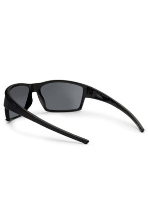 The Liive X Ignite X Sunglasses feature a black wrap-style frame with dark lenses, shown from the rear on a white background. Their sporty, sleek design and curved arms showcase a modern silhouette.