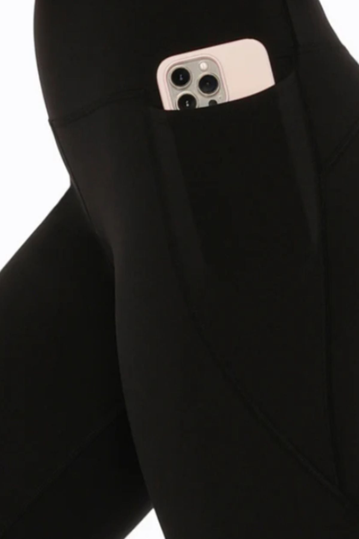 A close-up of Lorna Jane Amy Phone Pocket 3/4 Tech Leggings in black, featuring a side pocket holding a smartphone in a white or light-colored case.