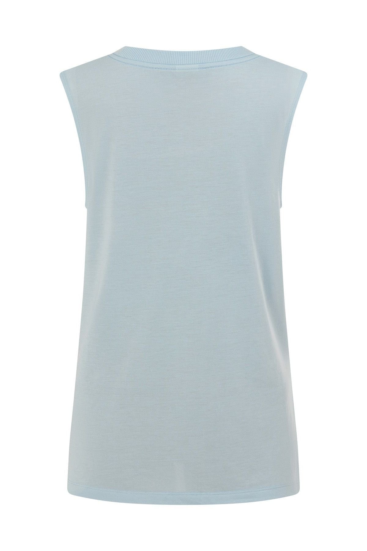 The Lorna Jane Lotus Muscle Tank is shown from the back in a light blue shade, featuring a crew neckline and a straight hem. The soft, smooth fabric is free from visible patterns or logos, making it an ideal lightweight layering piece for everyday comfort.