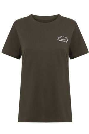 The Lorna Jane Lotus T-Shirt is a plain, short-sleeved women's sportswear top in dark olive green, featuring a small white "LORNA JANE LUXE ATHLETIC" logo on the upper left chest—ideal for an active lifestyle.