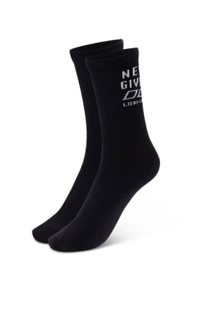 The Lorna Jane Never Give Up Arch Support Crew Socks are black crew socks with ribbed cuffs, cushioned soles, and white text near the top that reads "NEVER GIVE UP" and "LORNA," shown on a plain white background.