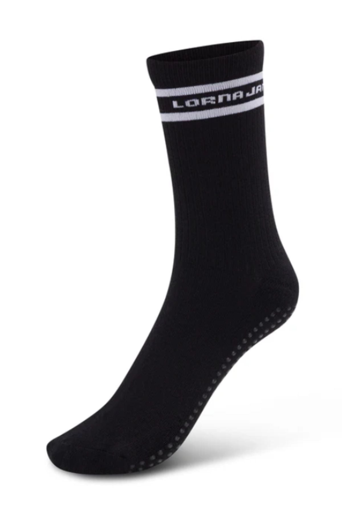 The Lorna Jane Pilates Grip Crew Socks are black with a white stripe and "LORNA JANE" near the top, plus small grip dots on the sole—ideal for Pilates. Only one crew-length sock is shown against a white background.