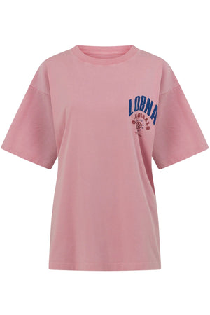 The Lorna Jane Revival Washed Boyfriend T-Shirt is a pink, 100% cotton tee with a vintage wash. It features "LORNA" in bold blue lettering and a small graphic on the left chest, plus short sleeves and a classic crew neck.