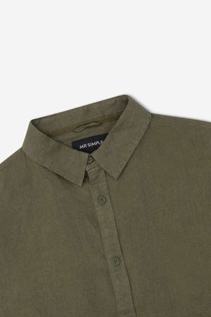The Mr Simple Linen Long Sleeve Shirt in olive green features a classic design with a pointed collar, visible buttons, and "MR SIMPLE" label inside. Made from lightweight fabric, it offers a casual, loose fit perfect for everyday wear.