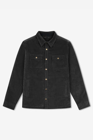 The Mr Simple Quilted Cord Jacket, shown against a white background, is a black cotton corduroy shirt featuring a collar and long sleeves. It boasts gold buttons down the front and includes two breast pockets with button flaps. The relaxed fit of this simple and classic design adds to its timeless appeal.