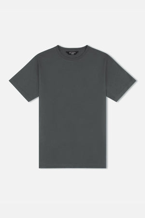 The Mr Simple Reginald Organic Tee is a plain T-shirt crafted from organic cotton in a dark gray hue. It includes short sleeves and a rounded neckline, highlighted against a white background, emphasizing its stretchy and durable design that is perfect for everyday wear.