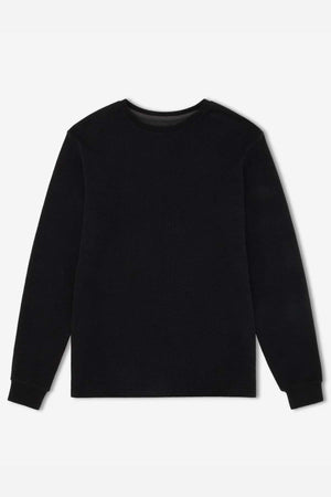 The Mr Simple Smith Waffle is a black long-sleeve crew-neck sweater displayed on a white background, showcasing its classic waffle fabric design made from organic cotton.