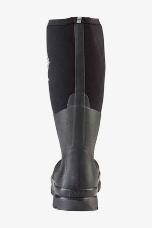 The Muck Boot Chore Steel Toe, shown from the back, features a tall waterproof black rubber shaft, reinforced heel, textured sole, and a vertical rear seam.