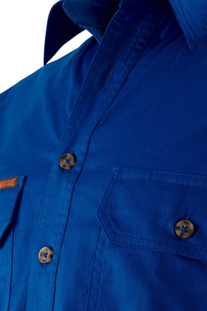Close-up of the Mustang Signature Closed Front Workshirt in blue cotton, featuring brown buttons, a collar, and a flap chest pocket.