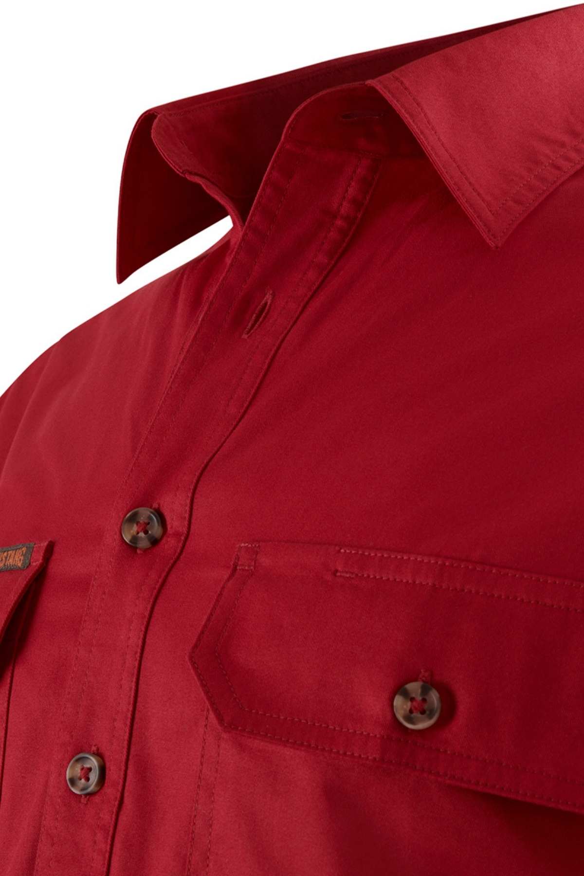 Close-up of the Mustang Signature Closed Front Workshirt, crafted from durable cotton. This red button-up shirt features a pointed collar, front buttons, and a chest pocket with a buttoned flap, ideal for robust workwear needs.
