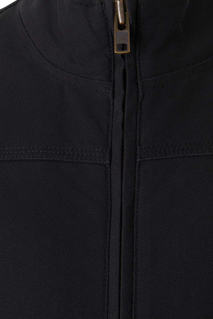 Close-up view of the Mustang Signature Outback Canvas Vest in black, featuring a brass-colored zipper partially visible at the top. The durable canvas material showcases a high collar and seam detail across the chest area, highlighting its sturdy and textured fabric.