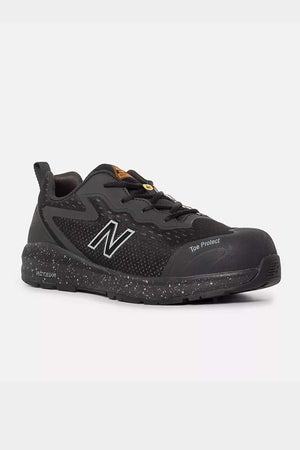 The New Balance Logic Safety Work Shoe is a black athletic shoe featuring a speckled sole, the brand's logo on the side, and "Toe Protect" near the toe area. This safety shoe offers a rugged design crafted from mesh and synthetic materials for durability and comfort, as well as slip-resistant properties for enhanced security.