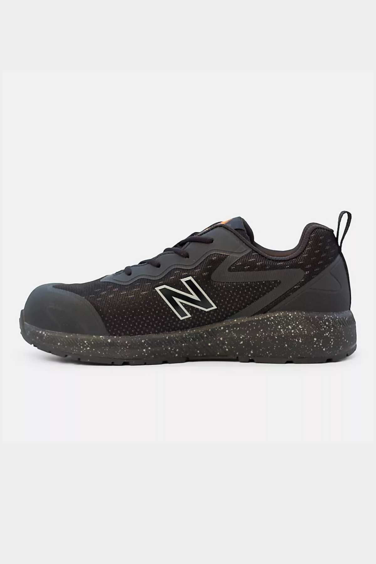 The New Balance Logic Safety Work Shoe is a black athletic shoe featuring a speckled black sole. It boasts a mesh upper with the iconic "N" logo on the side, a low-top design, black laces, and a pull tab on the heel. This slip-resistant safety shoe also includes a Kevlar midsole for added protection.