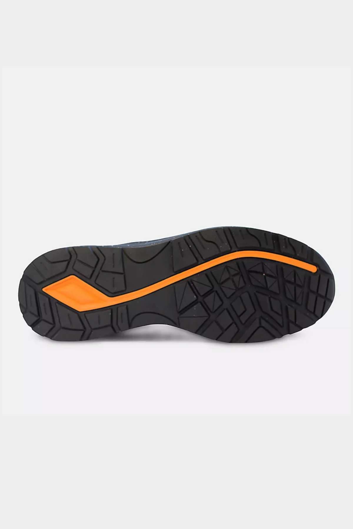 The image displays the bottom view of the New Balance Logic Safety Work Shoe's sole, featuring a prominent orange line running through its center. The slip-resistant black sole boasts a textured tread pattern designed for enhanced grip and traction. The surrounding background is plain white.
