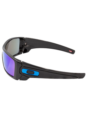 Side view of Oakley Batwolf sunglasses, showcasing blue and black arm accents, a single lens design, and bold purple-tinted lenses.