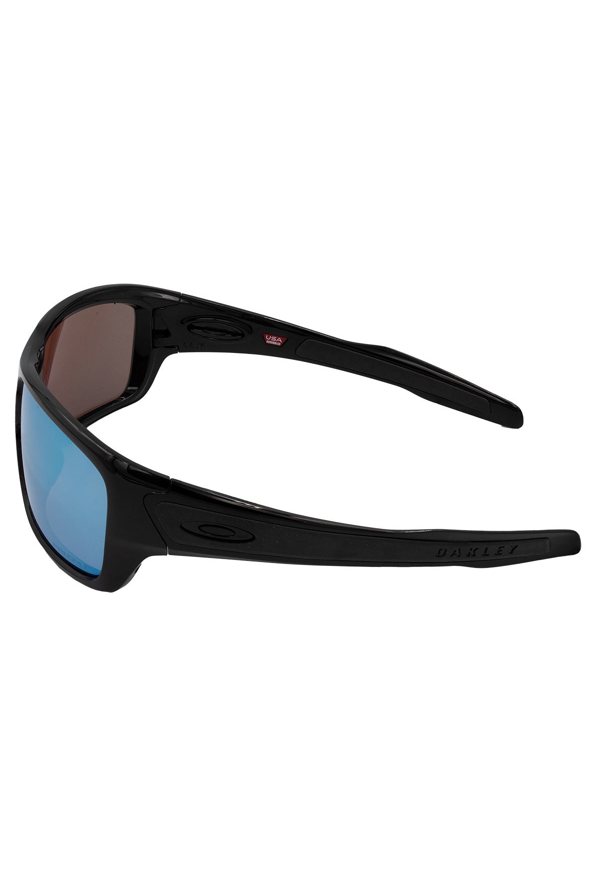 The Oakley Turbine features a sleek, sporty wraparound design with blue-tinted lenses, subtle branding on the frame, and a curved shape for a secure fit.