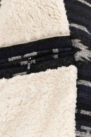 The Outback Marc Jacket features a brushed shell, textured cream fleece-like material, and dark woven fabric with gray and white geometric designs. It includes a visible 2-way zipper partially embedded in the berber lining section.