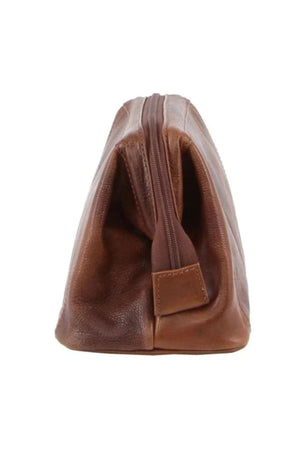 The Pierre Cardin Leather Toiletry Bag, in brown genuine leather, is displayed upright from the side with a vertical zipper. It stands on a flat surface against a white background.