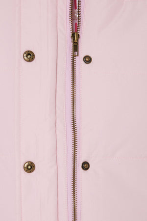 Close-up of the Pilbara Ladies Vest, a light pink quilted design with Polyfill padding, silver zipper, and metallic snap buttons.
