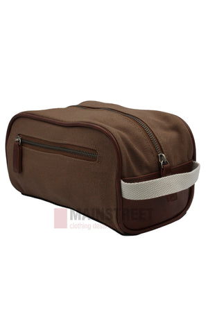 The Pilbara Toiletry Bag is a brown rectangular canvas bag with a top zipper, side zipper pocket, and white fabric handle—ideal for luxury travel.