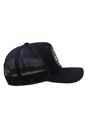 Side view of the Pilbara Western Established Cap—black, with a breathable mesh back, solid front panel, and curved brim. An embroidered western-style logo appears on the front. The cap is set against a white background.