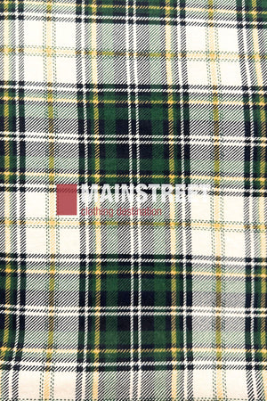 The Pilgrim Closed Front Flannelette Shirt - King Size features a green, yellow, black, and white plaid pattern with "MAINSTREAM clothing distribution" faintly centered. Made from 100% cotton for comfort and style.