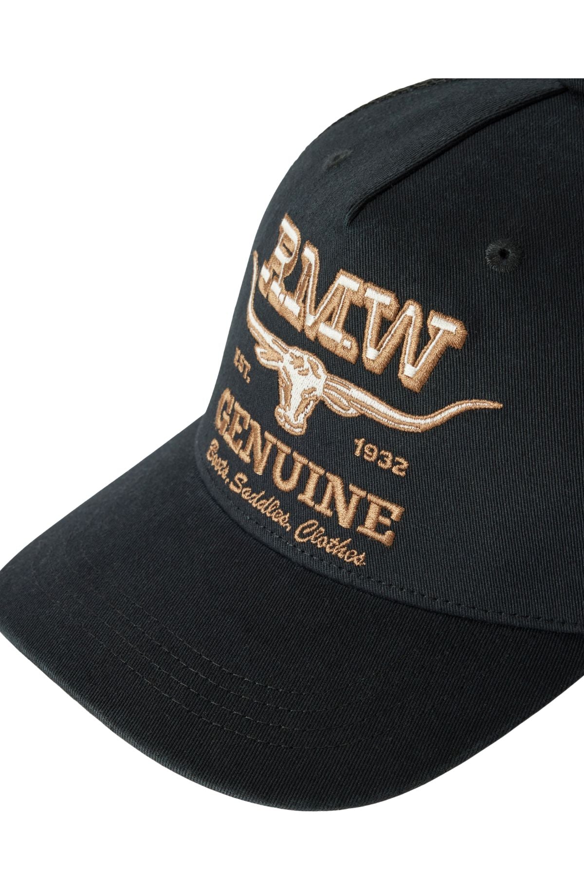The RM Williams Genuine Longhorn Trucker Cap is black with tan embroidery reading “B.M.W Genuine, Best Saddles, Clothes, Est. 1932” and features a bold steer skull and long horns graphic on the front.