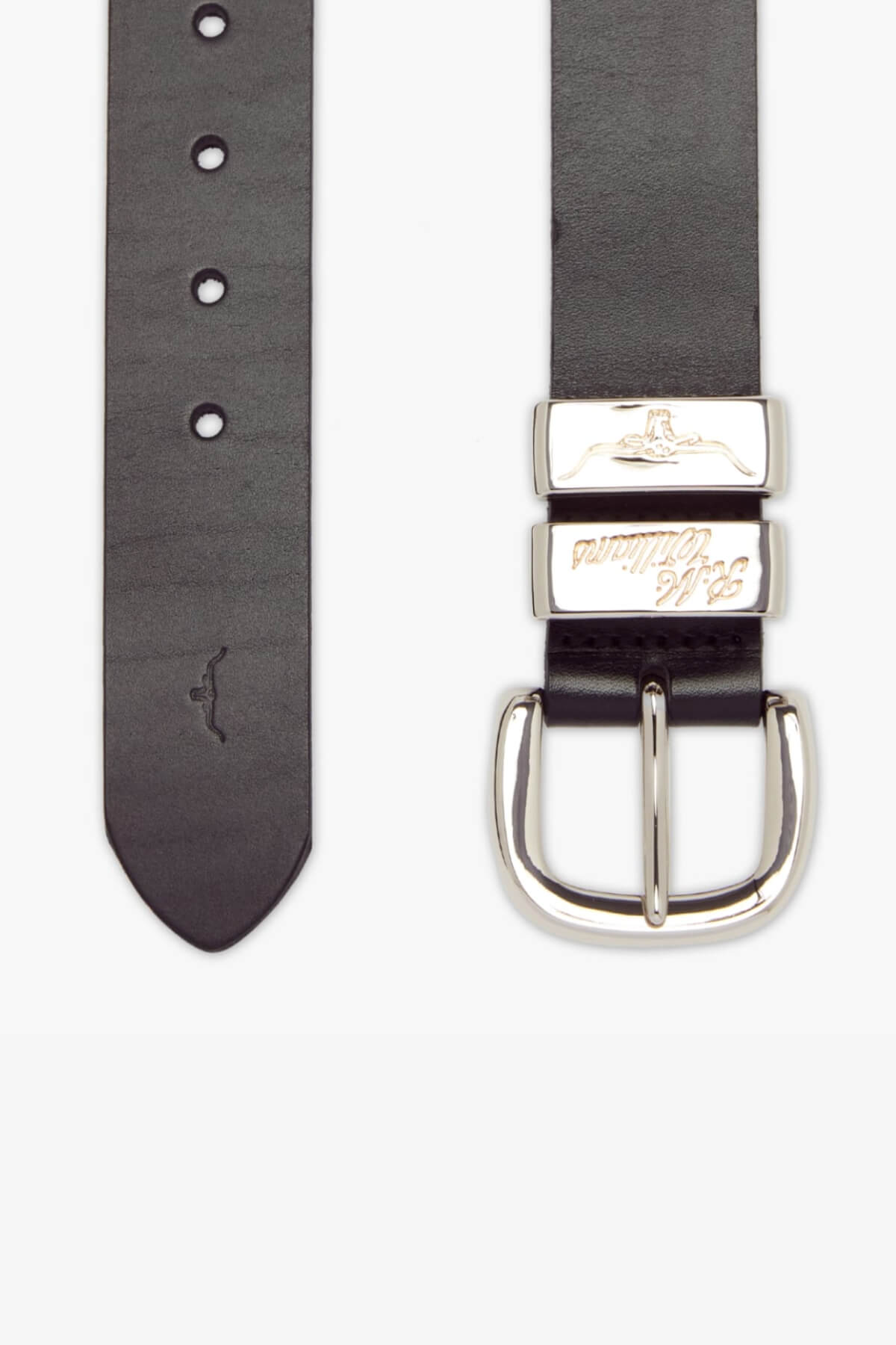 The RM Williams 1 1/2 Jerrawa Belt is a black leather belt crafted in Australia, featuring a solid hide leather construction and a polished nickel buckle with two silver keepers. It includes several adjustment holes and showcases a subtle imprint of a kangaroo near the tapered end.