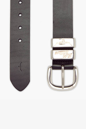 The RM Williams 1 1/2 Jerrawa Belt is a black leather belt crafted in Australia, featuring a solid hide leather construction and a polished nickel buckle with two silver keepers. It includes several adjustment holes and showcases a subtle imprint of a kangaroo near the tapered end.