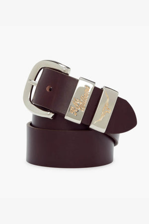 The RM Williams 1 1/2 Jerrawa Belt is made from solid hide leather and features a polished nickel buckle with metal accents. Both the buckle and one of the metal accents are engraved with detailed designs, including text and an embossed emblem. The dark brown belt is coiled on a white background.