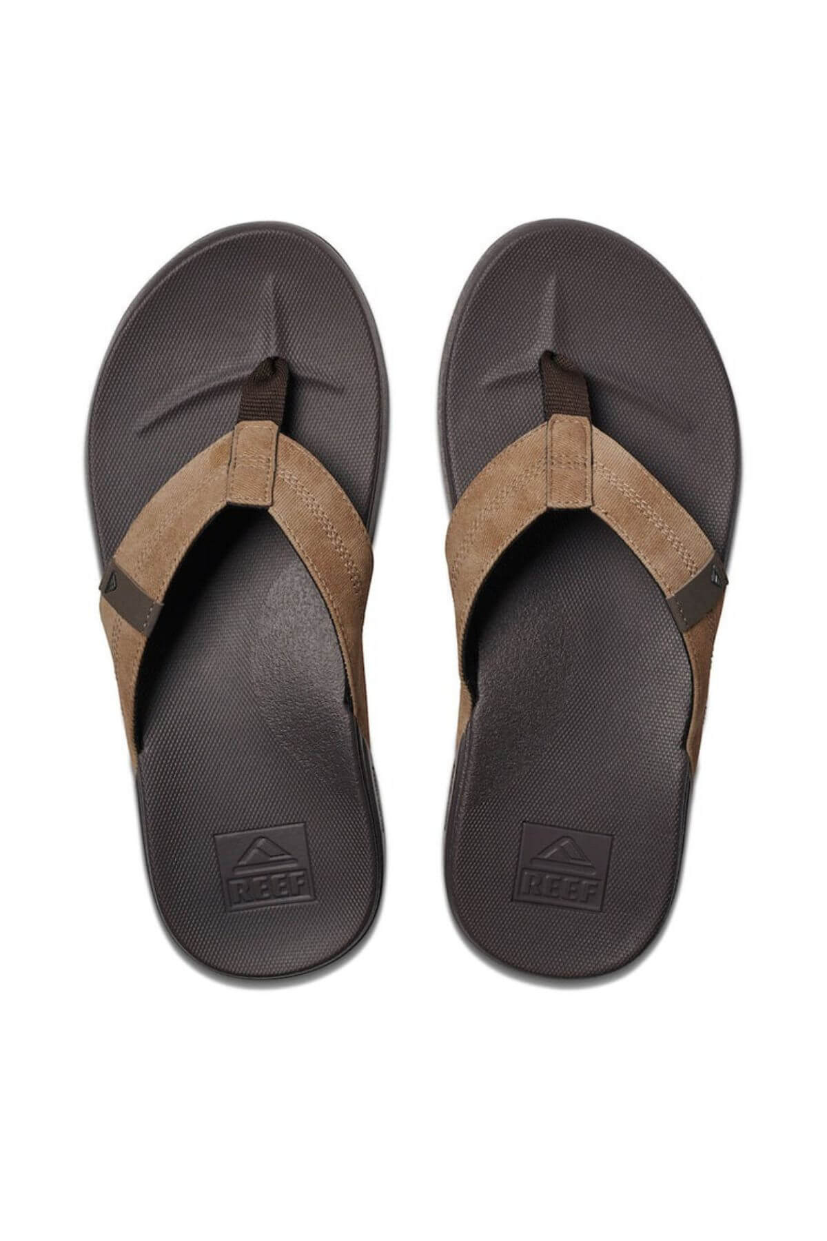 Brown and black flip-flops with a leather-like strap and textured sole for added comfort. The REEF Cushion Phantom name is embossed on the footbed, ensuring durability with every step.