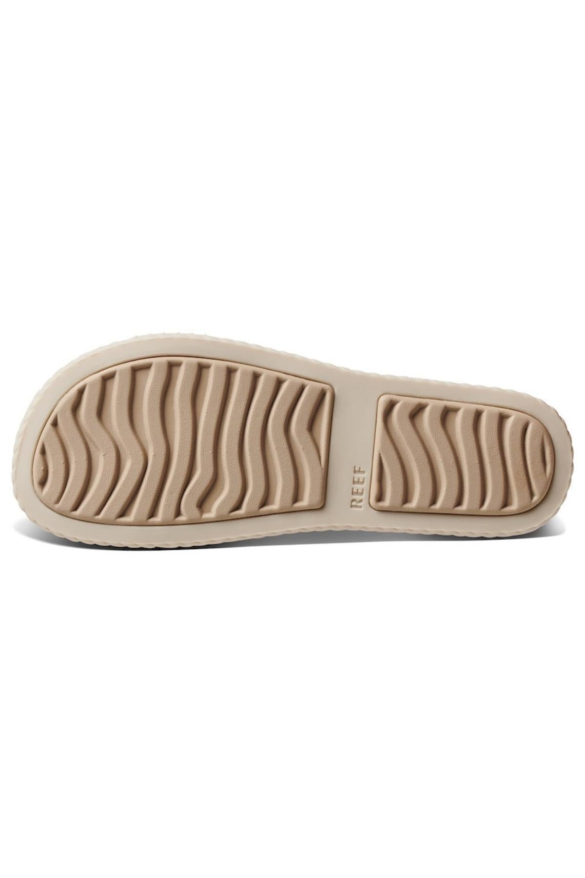 The REEF Water Vista Duo features a beige and white sole with deep, wavy tread patterns and rectangular grip sections, shown from the bottom. The brand name appears near the arch area.